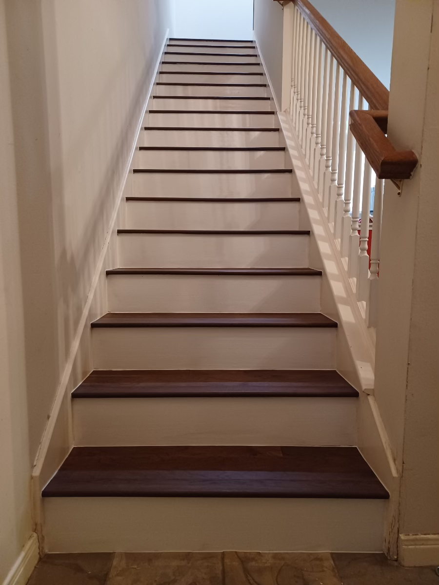 staircase installation with white risers, wfa's custom hardwood floors, houston texas